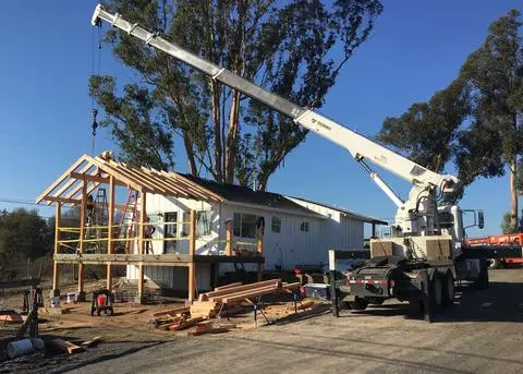 Boom Truck Working on a Small Construction Site